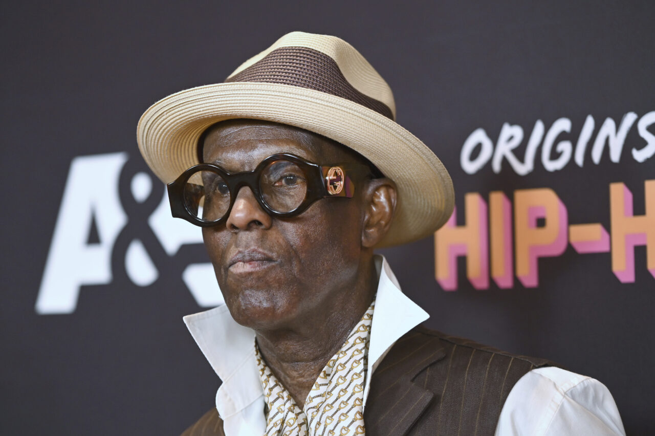 Dapper Dan standing on the red carpet.